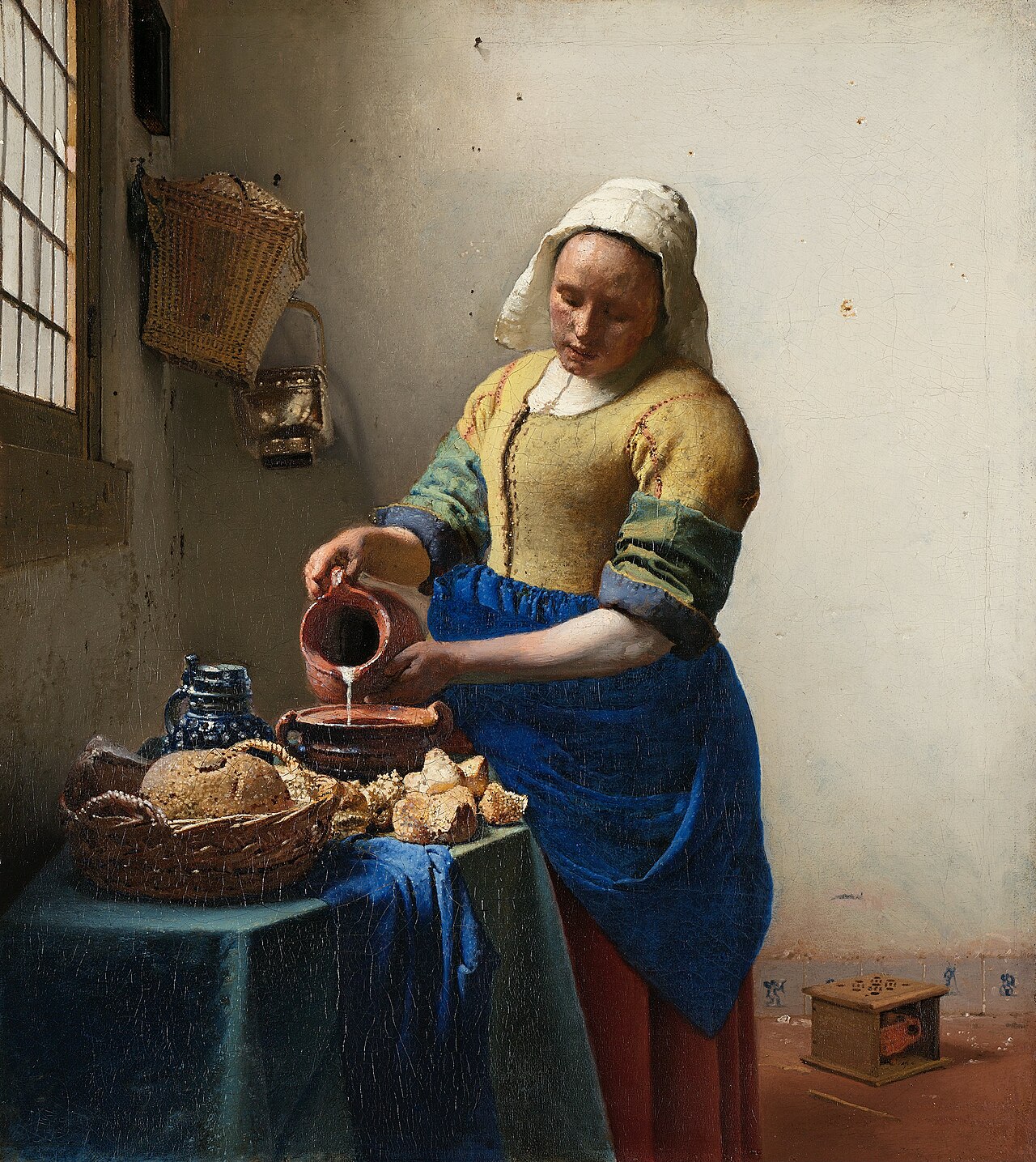 Johannes Vermeer,《倒牛奶的女仆》,约 1658(左侧窗光的经典范例)